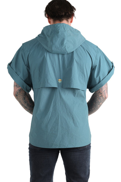 Person wearing a light blue jacket with a hood on a white background